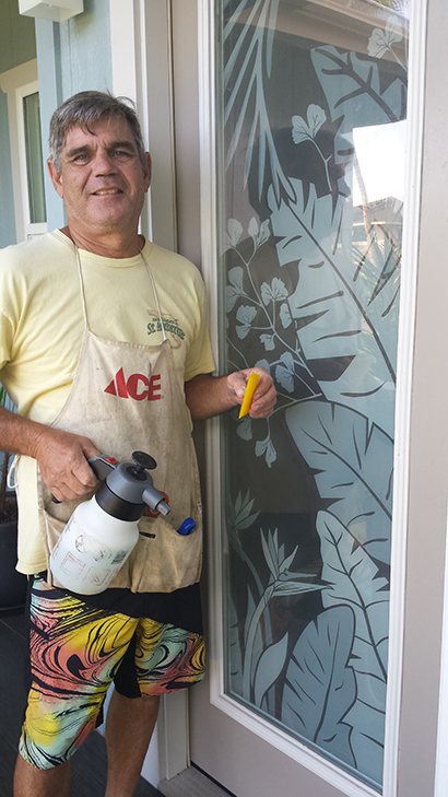 Mike's Mobile Tinting installing residential window film in Kauai